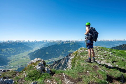 Hiker looks down into the Inn valley