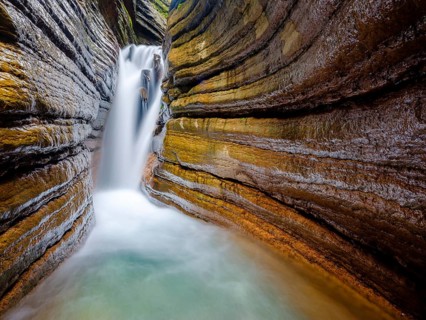 The Taugl or Tauglbach flows through the red gorge