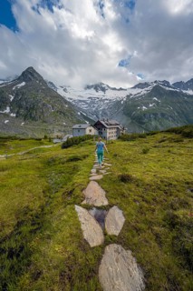 Hiker on the way to the Berliner Huette on the Berliner Hoehenweg