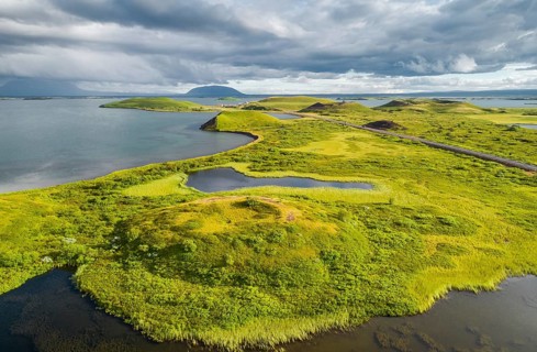 Aerial view of green volcanic crater