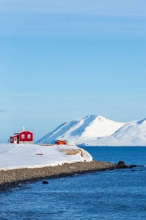 Lonely red house on the Akureyrifjord
