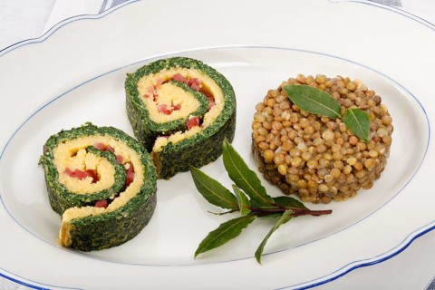 Polenta Spinach Roulade with Alblinsen arranged on a serving plate