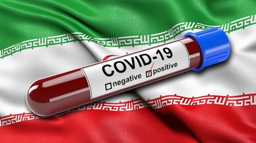 Flag of Iran waving in the wind with a positive Covid-19 blood test tube. 3D illustration