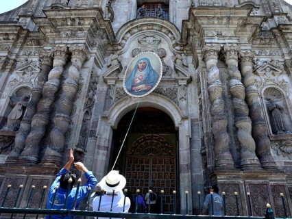 A picture of the Virgin Mary is attached to the facade
