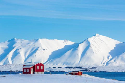 Lonely red house on the Akureyrifjord