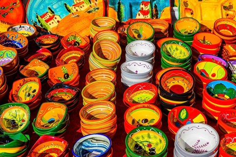Colourful pottery at the weekly market market in I'Isle-sur-la-Sorgue