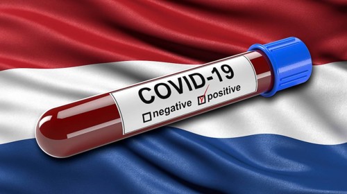 Flag of the Netherlands waving in the wind with a positive Covid-19 blood test tube. 3D illustration