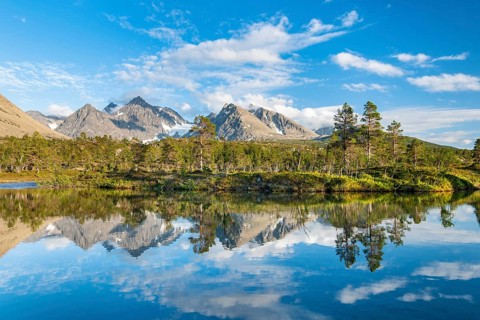 Mountains of the Lyngen Alps are reflected in the lake