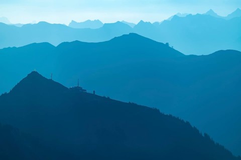 Summit station of the Diedamskopf Bahn at the blue hour with the Allgaeu Alps behind