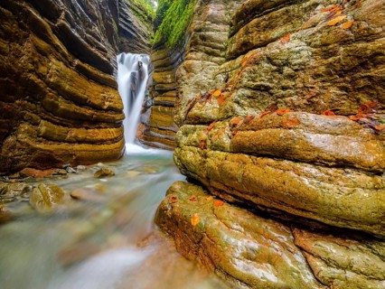 The Taugl or Tauglbach flows through the red gorge