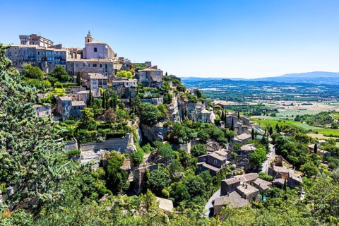 Nested houses of the mountain village of Cordes with castle and church on the top