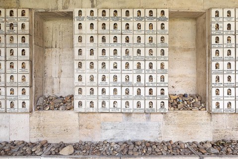 Wall with memorial plaques and deposited stones in memory of the murdered Jews and the Holocaust