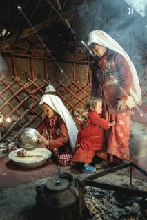 Two woman and a child in traditional Kyrgyz traditional traditional traditional traditional traditional traditional traditional traditional traditional costume