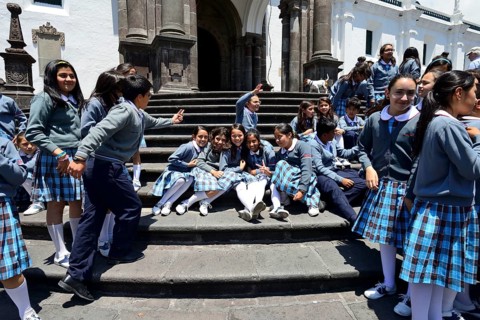 School class in school uniform on the steps of the cathedral