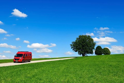 Motorhome on picture book country road near Berg