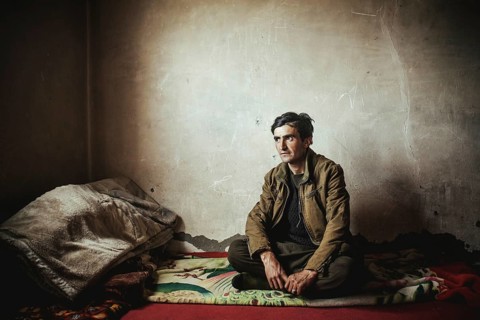 Man sitting on a blanket