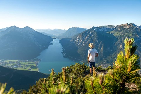 Young man looking over mountain landscape