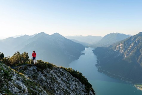 Young man at the summit of Baerenkopf