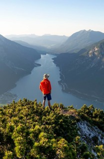 Young man looking over mountain landscape