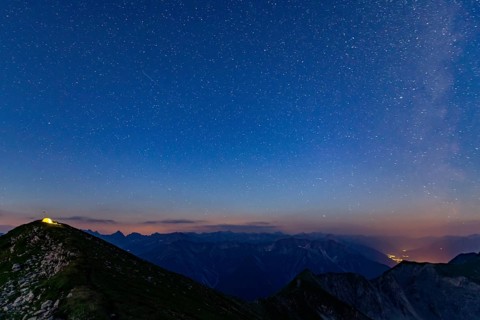 Starry sky summit of Kreuzspitze and tent