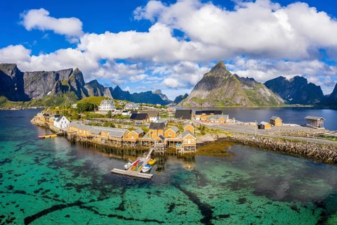 Rorbuer cabins by the fjord with Bergen in the background