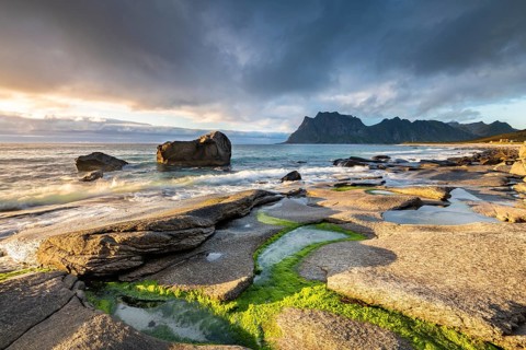 Rocks on the beach of Uttakleiv at evening light