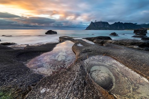 Rocks on the beach of Uttakleiv at evening light
