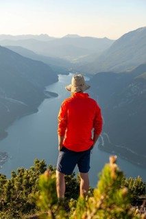 Young man looking over mountain landscape