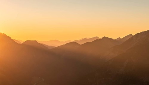 Sunset behind mountain silhouette