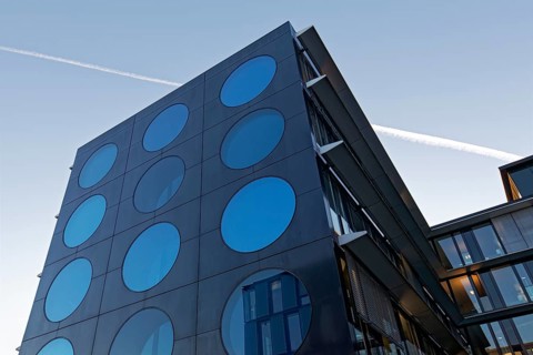 Facade with blue portholes