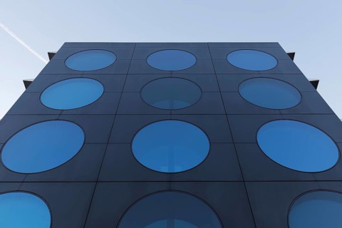 Facade with blue portholes