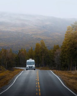 Campervan drives on the road to Kautokeino in autumn