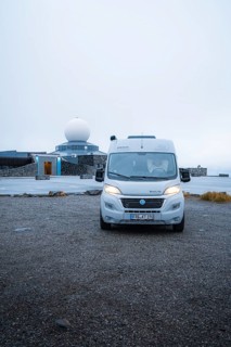 Campervan parked in front of the North Cape building