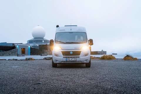 Campervan parked in front of the North Cape building