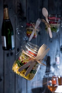 Food in glasses with wooden cutlery