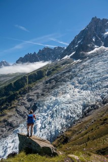 Hiker in front of glacier tongue
