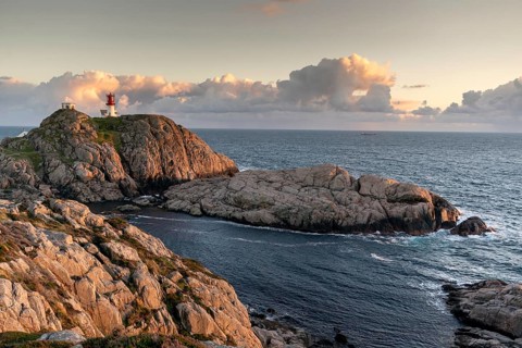 Lindesnes lighthouse at rocky coast
