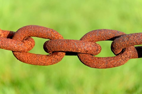 Several rusty chain links
