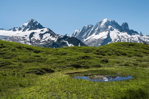 Small mountain lake at Aiguillette de Poisettes