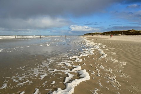 View over the north beach with waves and foam formation