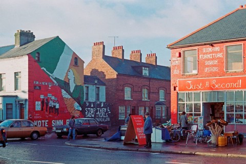 Street scene with car traffic and shops