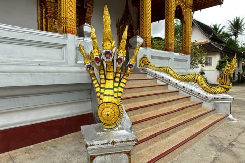 Five-headed mythological Naga serpent decorates the end of a stair railing