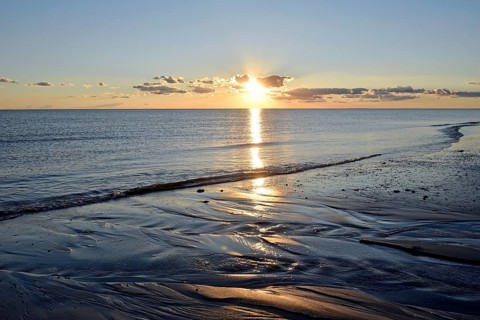 Sunset at the sandy beach Nebel