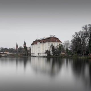 View over the Dahme river to Koepenick Castle and the Long Bridge in Berlin in the morning