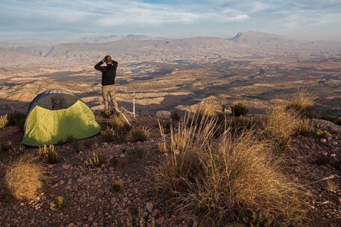 Young man contemplates the landscape of the Jbel Bou Naceur mountain in the province of Sefru