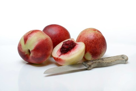 Halved nectarine and nectarines