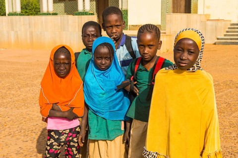 Local school children look at the camera