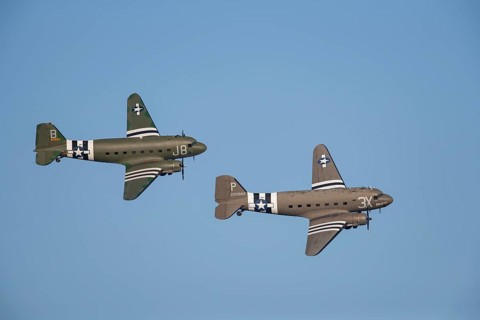 Douglas C-47 Dakota two aircraft in flight in United States Airforce markings
