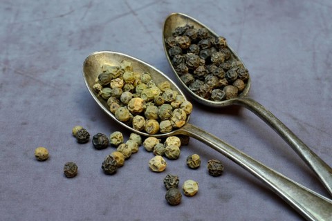 Peppercorns in spoon