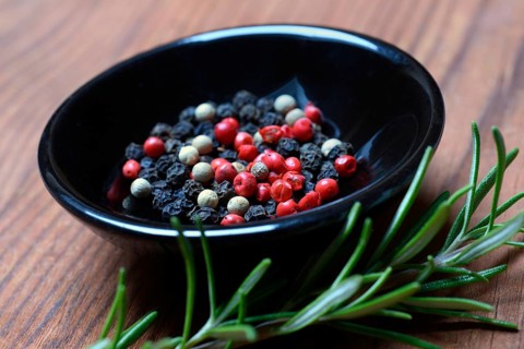 Black and white peppercorns in shell